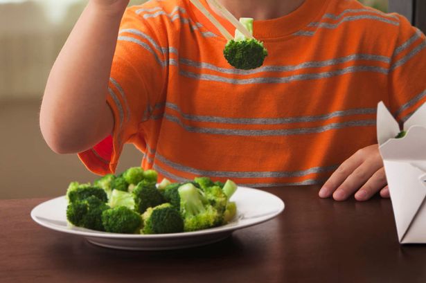 boy-eating-broccoli